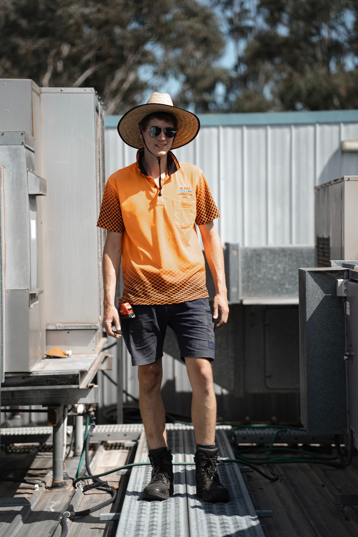 ABL team member working on rooftop air conditioning system